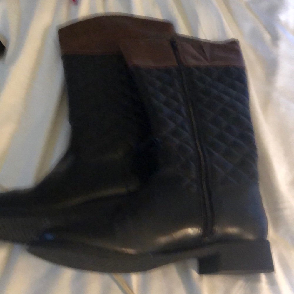 Black riding boots with brown trim